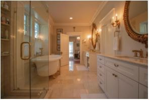 Master bathroom with gold mirrors and double vanity