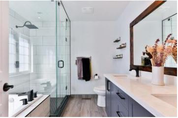 Large renovated bathroom with walk-in shower and glass door
